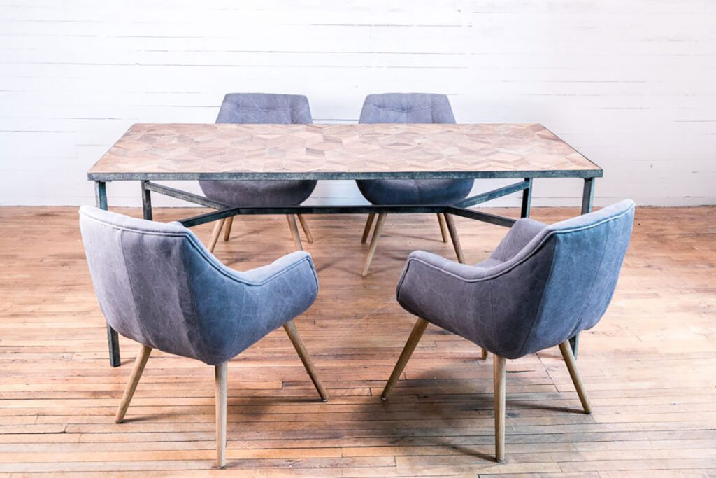 four gray chairs around a rectangular dining room table