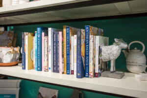 vertically arranged books on a shelf at accessories inc