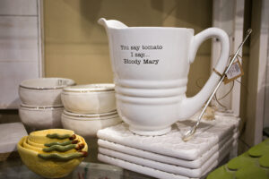 white pitcher that says "you say tomato I say...bloody mary"