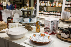 tins of peanuts, a box of peppermint fudge baking mix, and a pumpkin pie dish