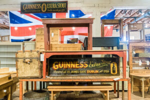 stacked wooden tables and a distressed Guinness sign