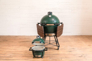 big green egg grill on a hardwood floor