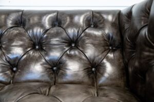 closeup of tufted leather couch