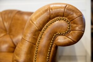 Hammered detail on arm of Leather Couch