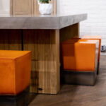 Seasonal Living ceramic table and orange seating