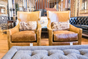light brown leather chairs in the green front showroom