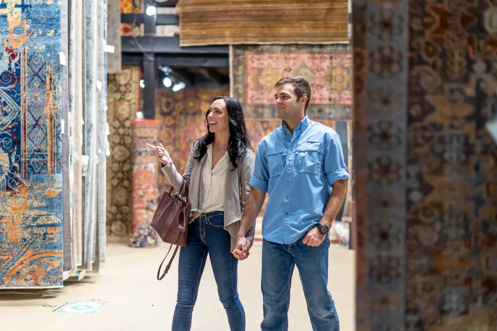 man and women browsing Green Front rugs