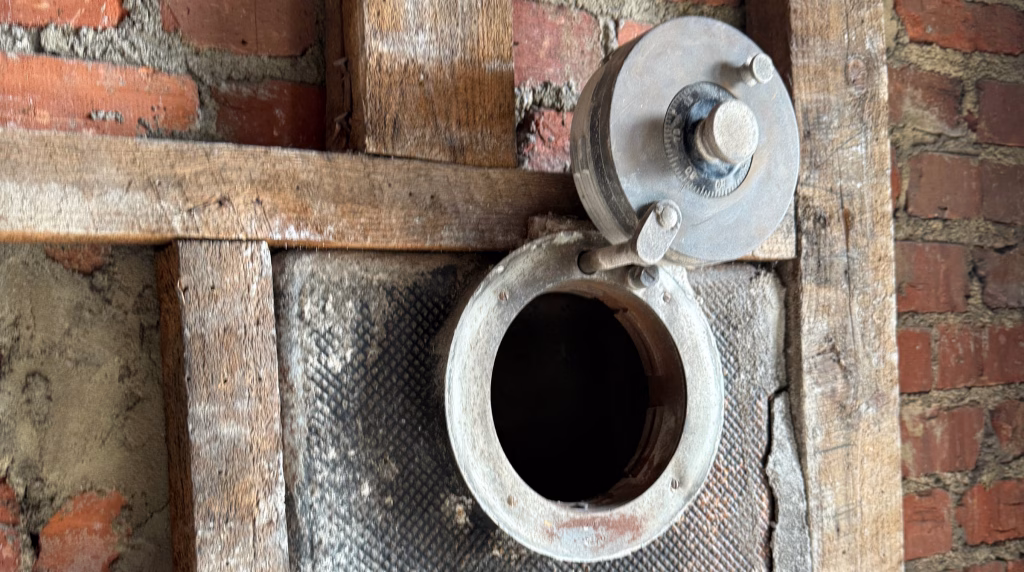 A hidden wall safe discovered in a historic home renovation by Den Cralle, President and CEO of the best furniture stores in Virginia